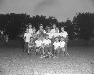 Group shot of happy boys at dusk after a thrilling game.