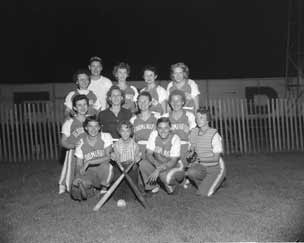 Women pose as team after game.