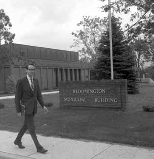 Nelson walking in front of City Hall.