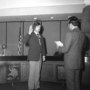 Benedict holds hand up.