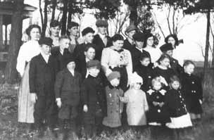 Surrounded by children.